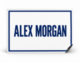 Personalized landscape magnetic name plate with a blue border and example Alex Morgan name